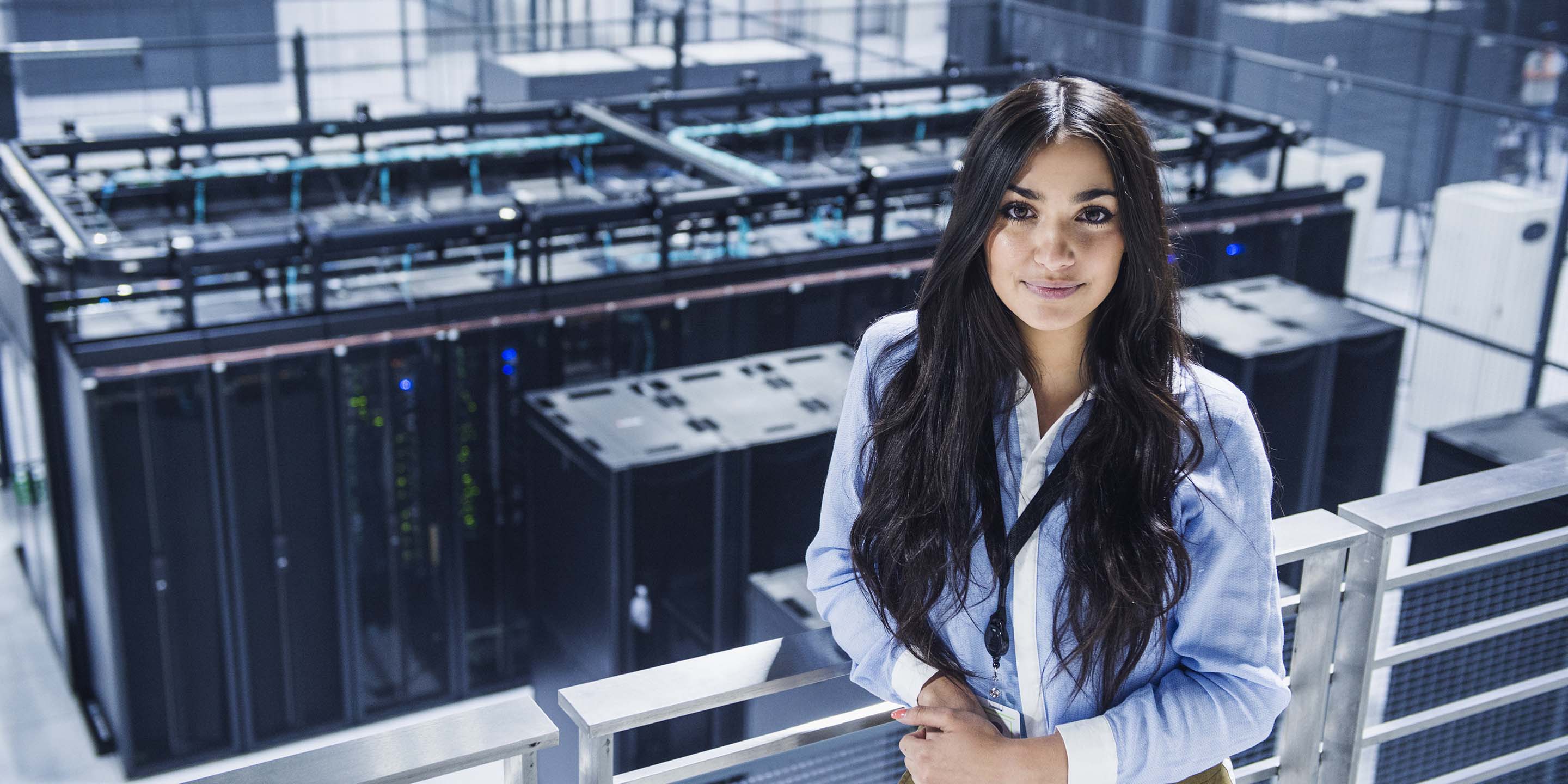 Lady standing at a top floor building
