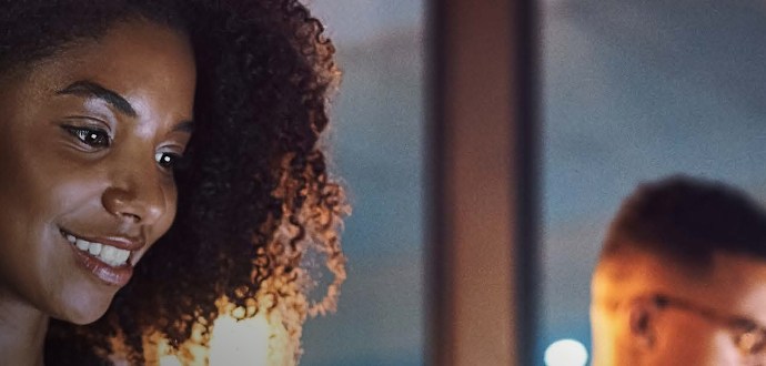 A man and a woman in a room with lights