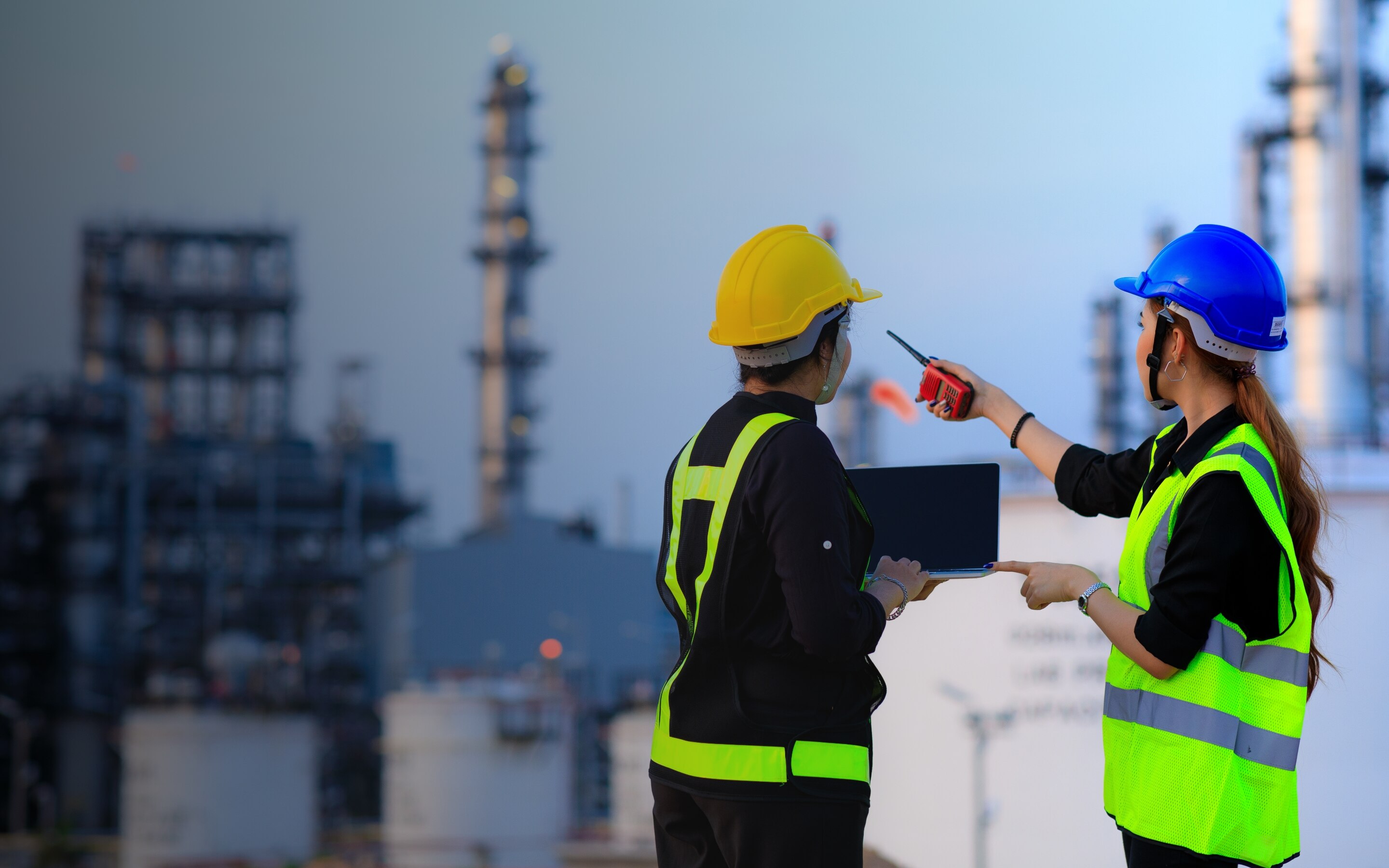 A man and woman wearing protective wear
