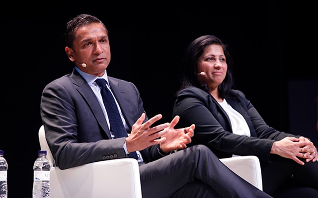Shahid and a woman in a conference