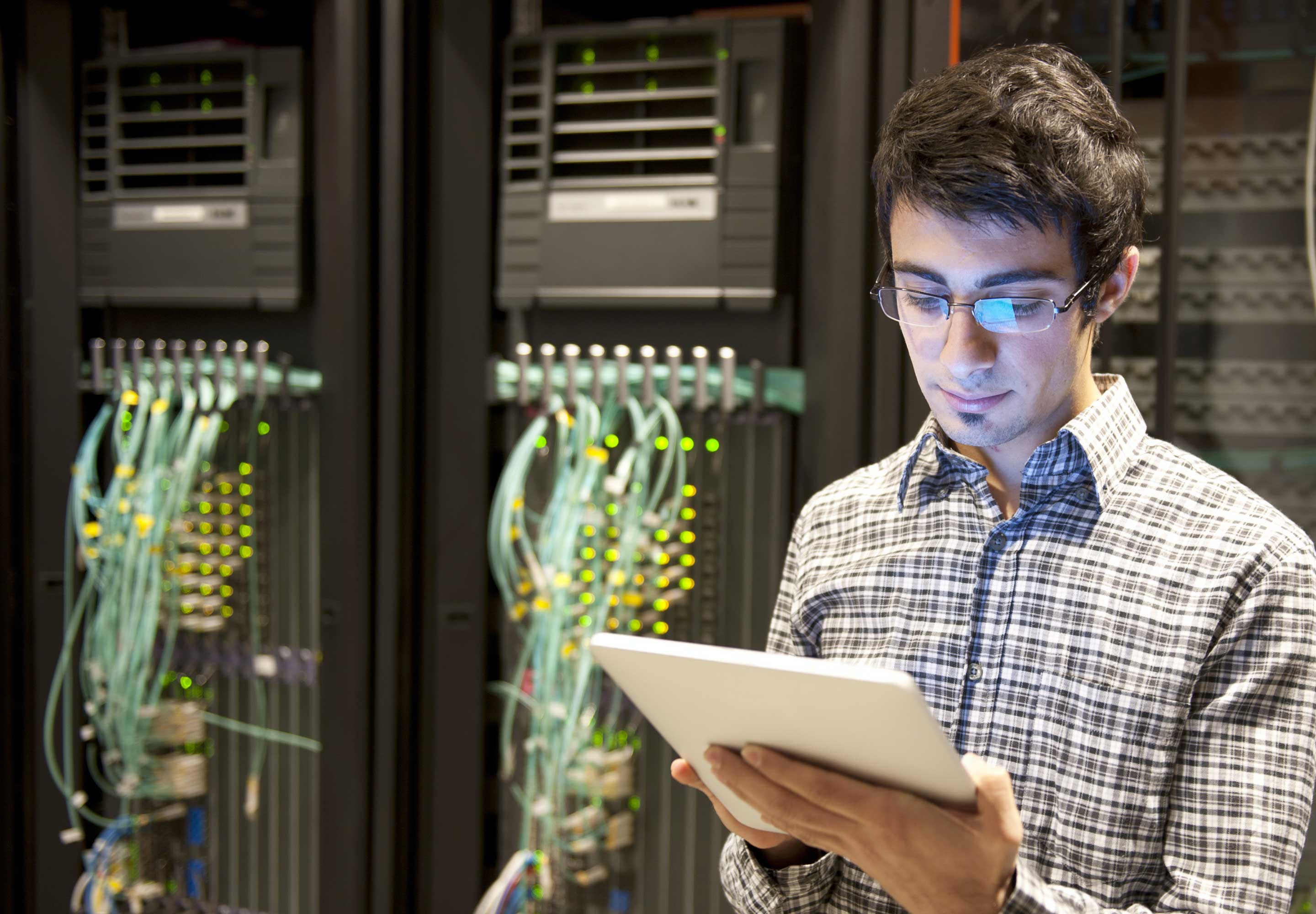 Man with an ipad a the server room