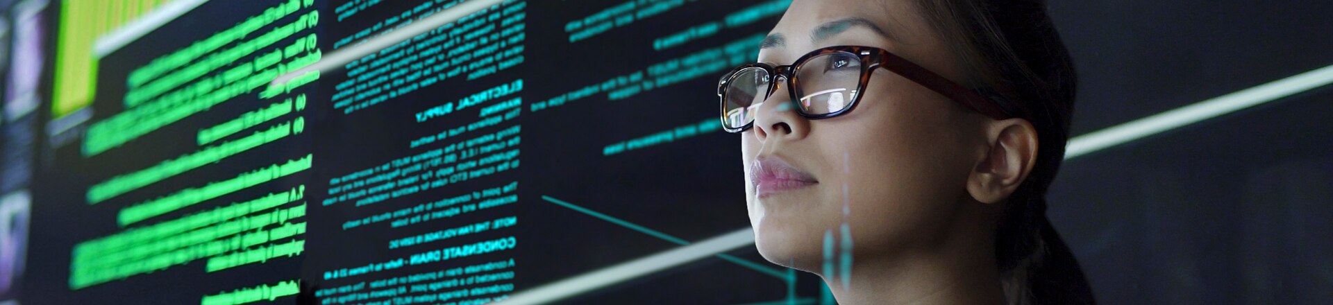 Woman surrounded by screens