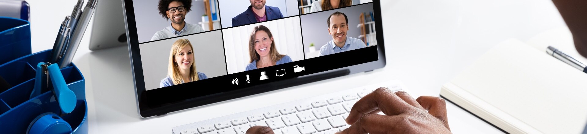 A persons laptop with a video conference happening