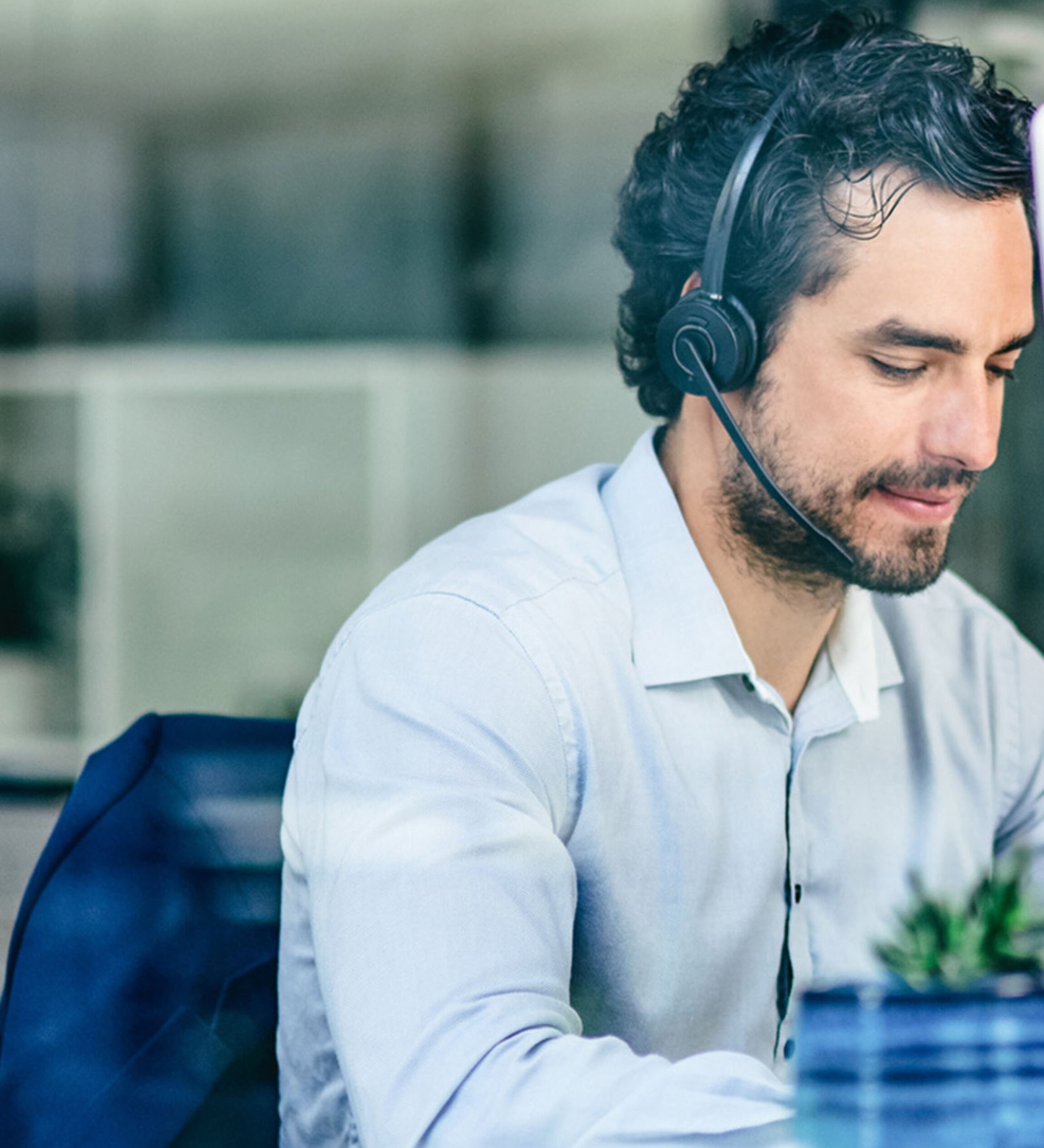 Man with headphones working on his computer