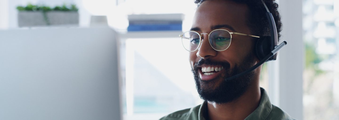 Smiling man wearing a headset
