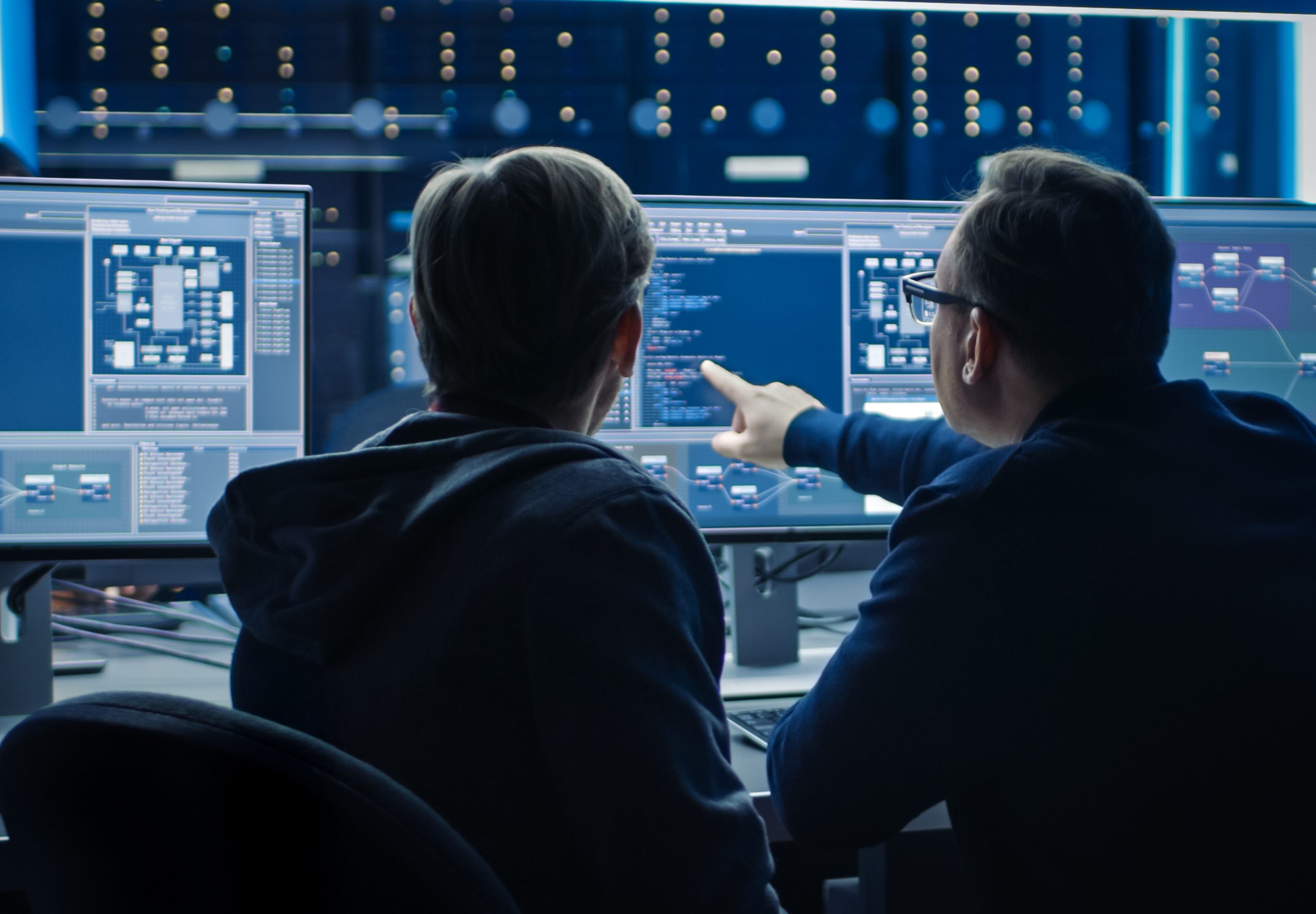 Two men looking at computer screens