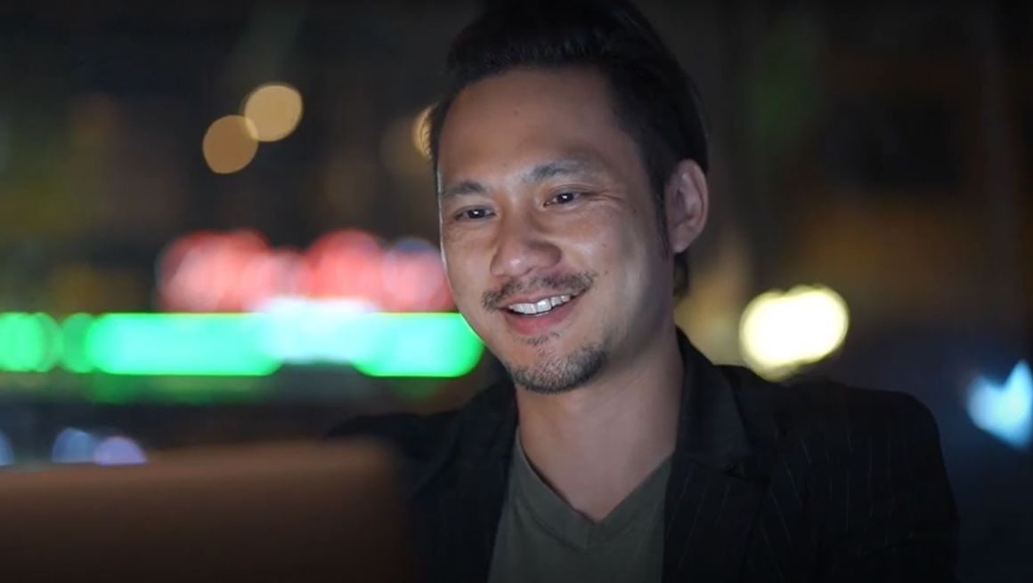 Smiling man doing doing online shopping