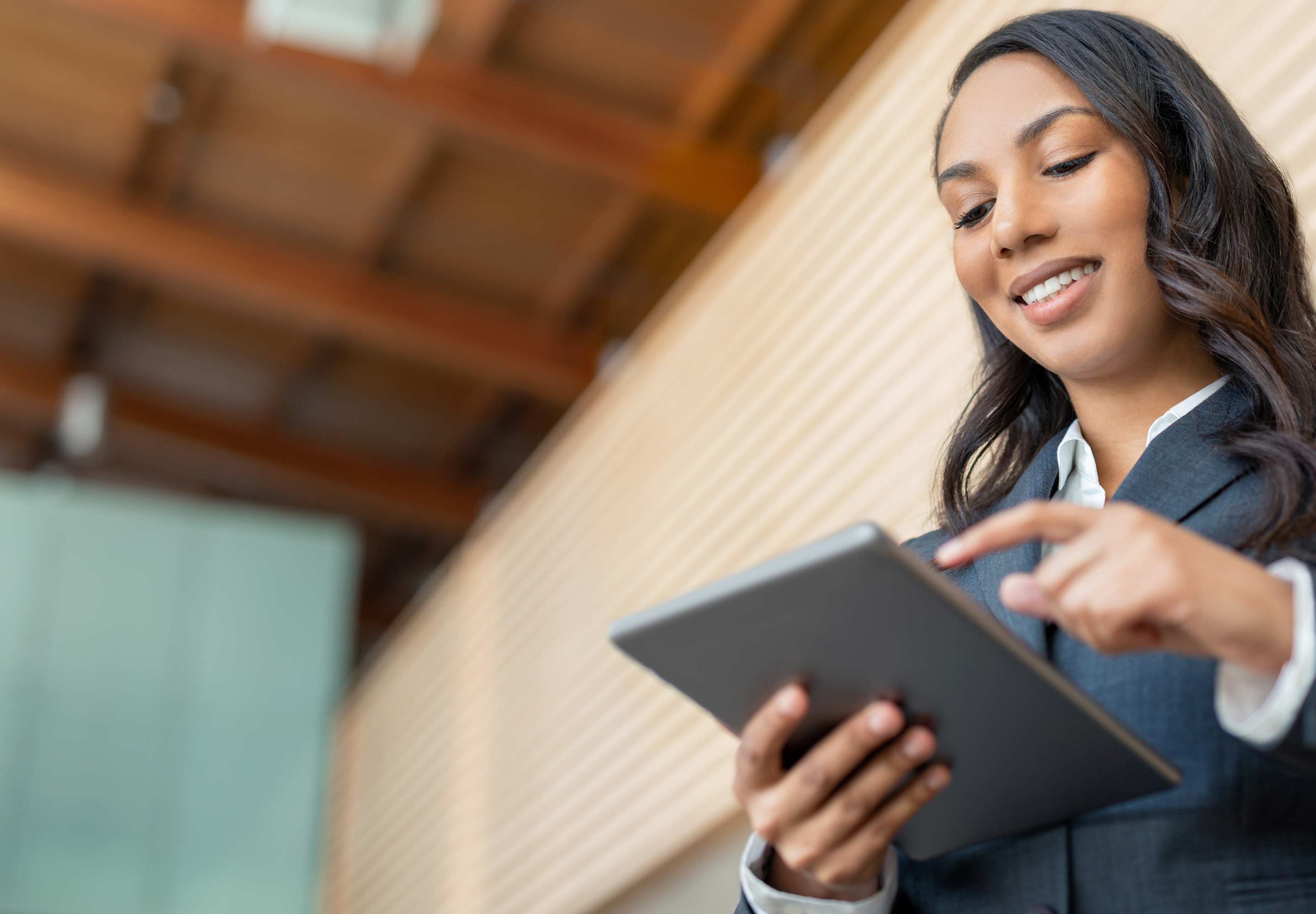 A woman holding a tablet