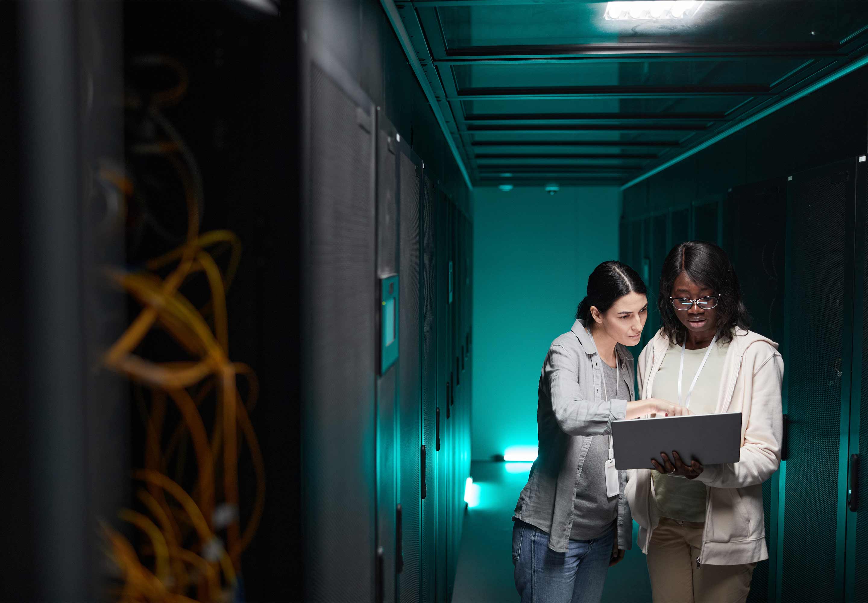 Two ladies looking on the laptop