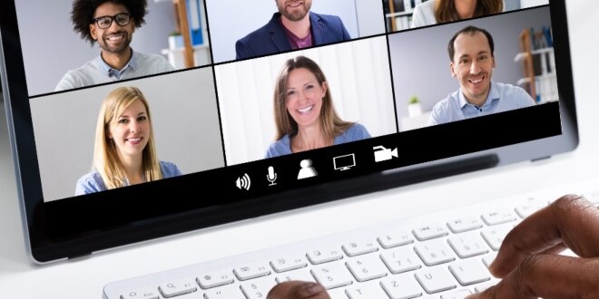 A person looking at head and shoulder images on the laptop
