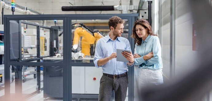 Two colleagues looking on the tablet