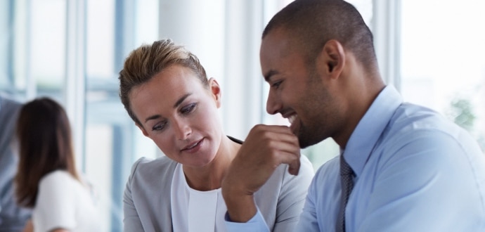 Business professionals looking on the tablet