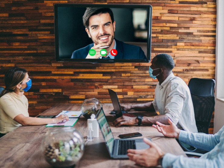 Team on a conference call with masks on