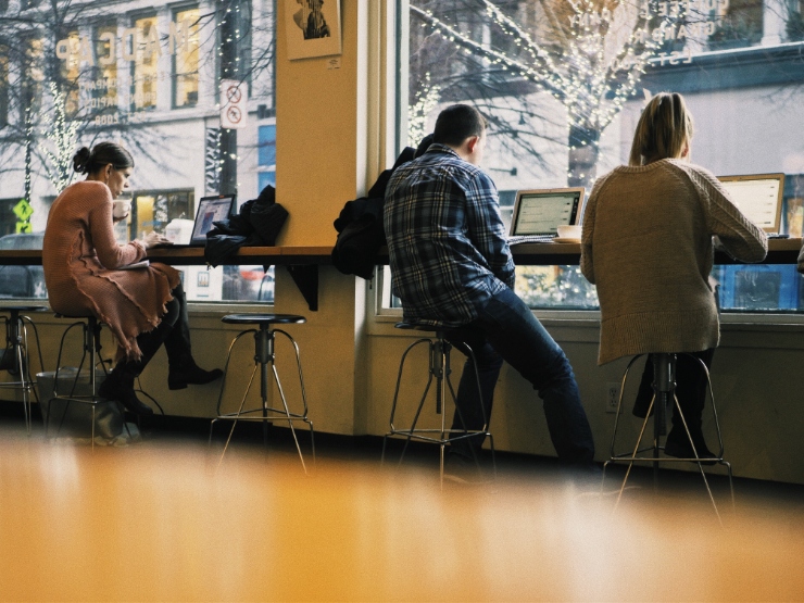 People sitting next to one another at a store