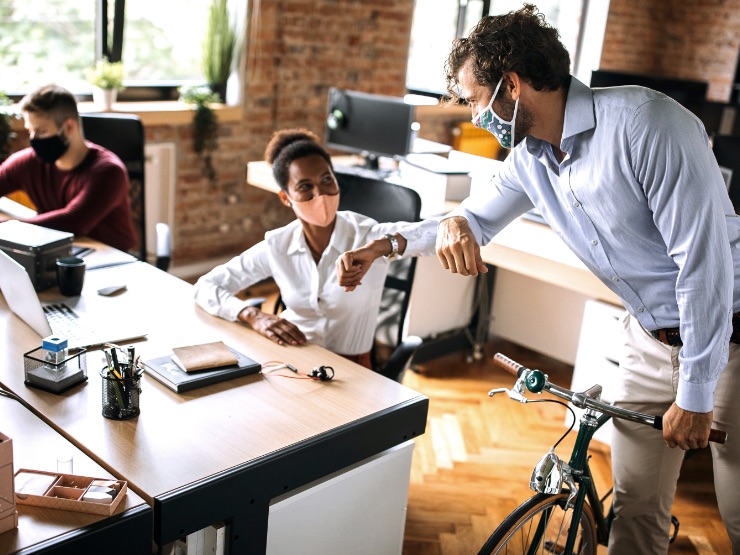 Colleagues greeting during covid-19